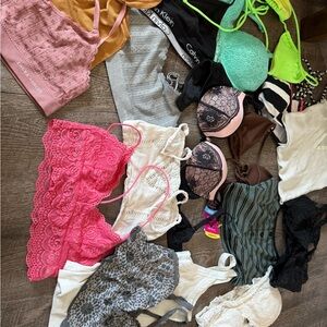 Multiple small bras, bikini tops and bralettes